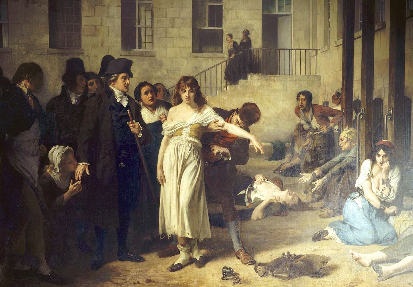 Pintura de un patio de hospital donde el médico Philippe Pinel observa cómo quitan las cadenas a una joven internada